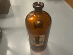 Large amber glass bottle