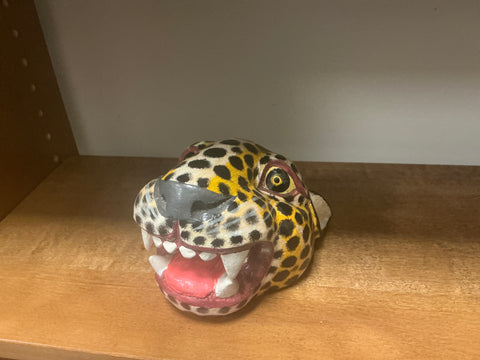 Carved and painted jaguar head