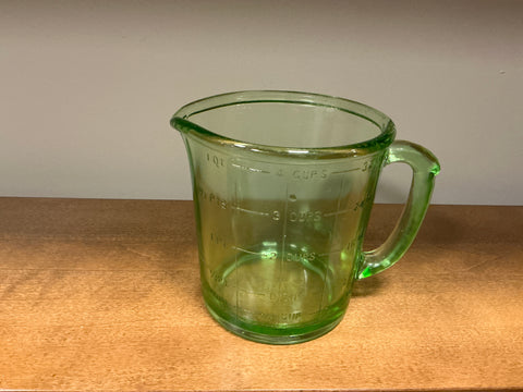 Green glass measuring cup